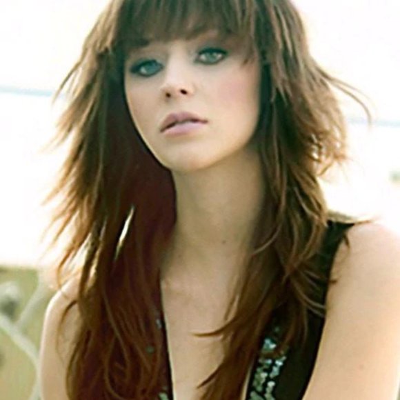 A modern edgy shag style is long and luscious with full choppy layers and bangs. main image 14